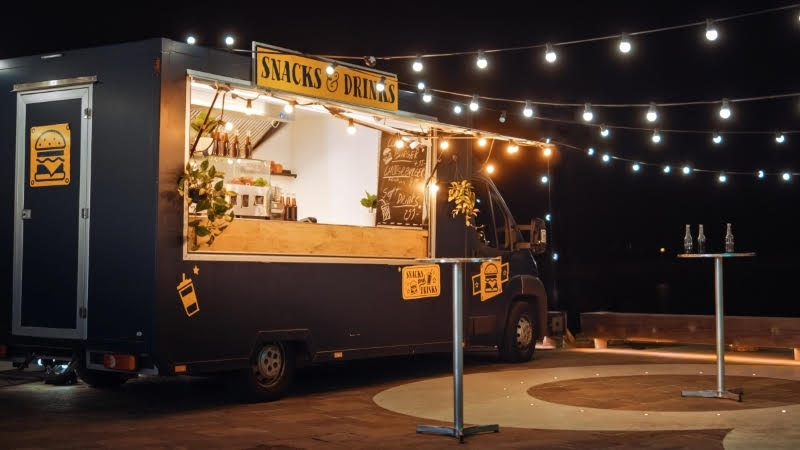 Food cart in Portland lit up at night with lights